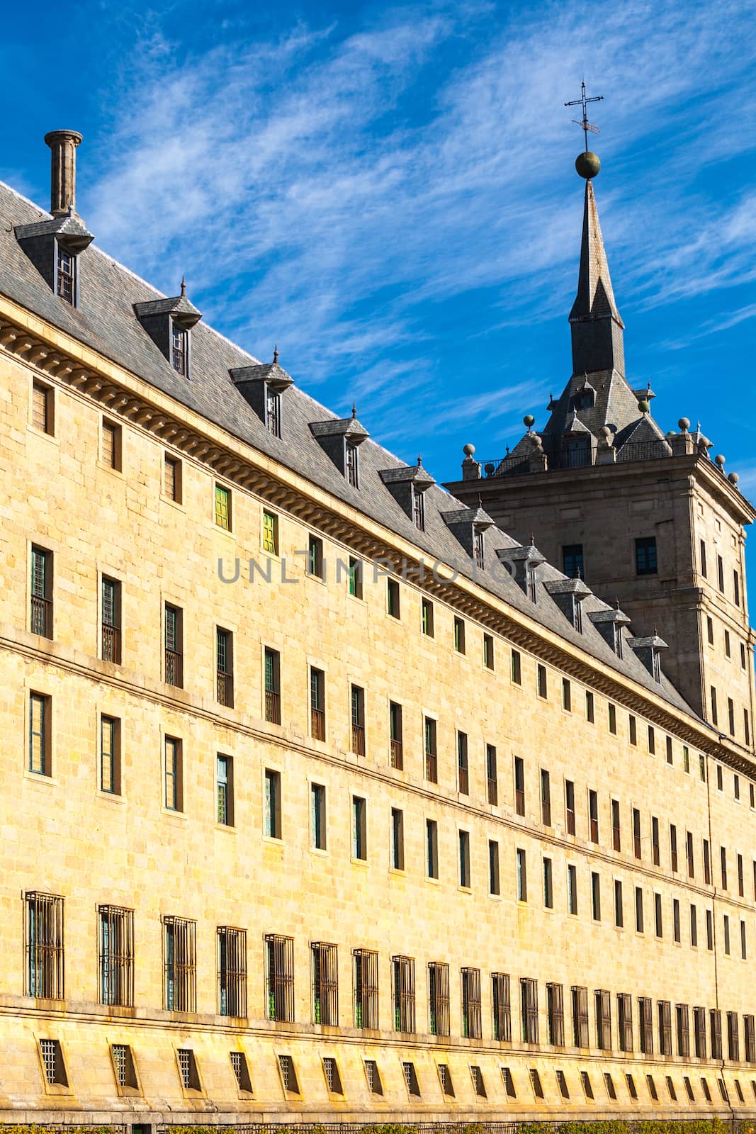 Perspective view of the Royal Site of San Lorenzo de El Escorial wir its dormer windows on the roof and a tower at the bottom