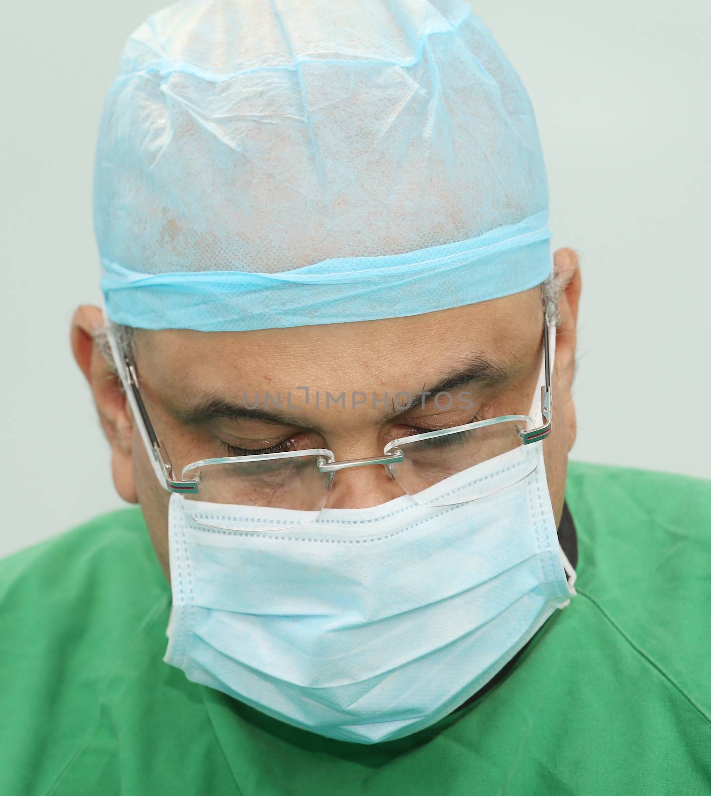 Portrait of a doctor during the surgery by dacasdo