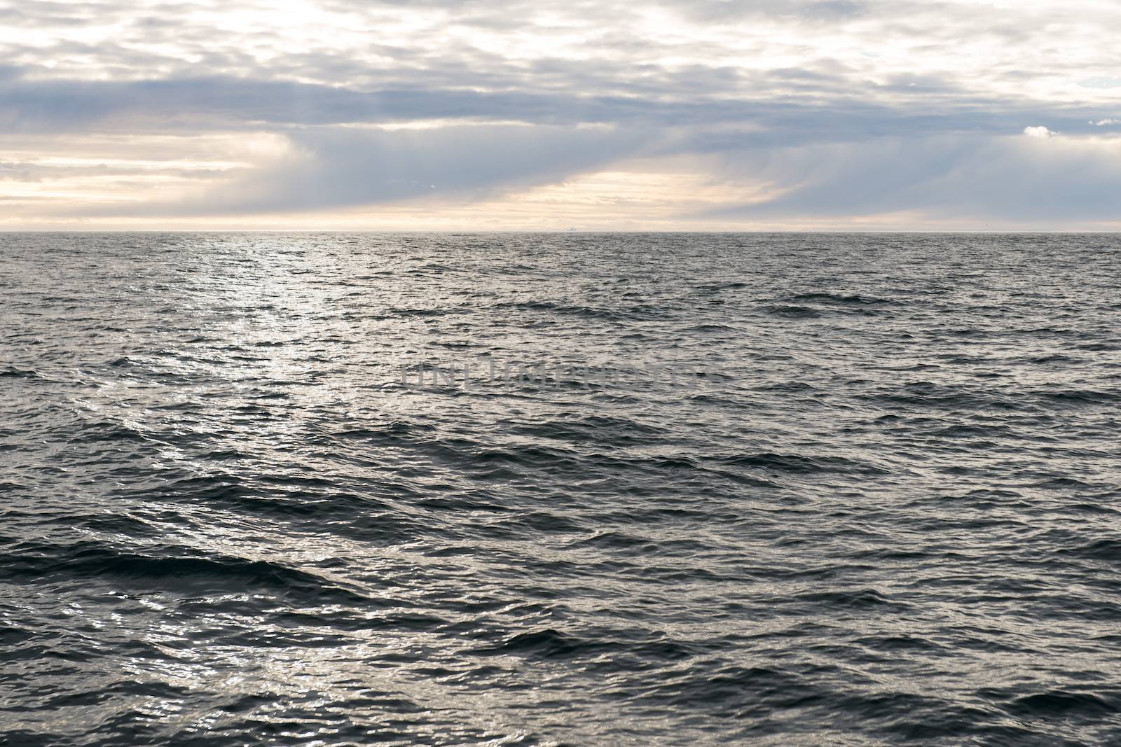 Ocean landscape in the arctic with an intense cloud pattern