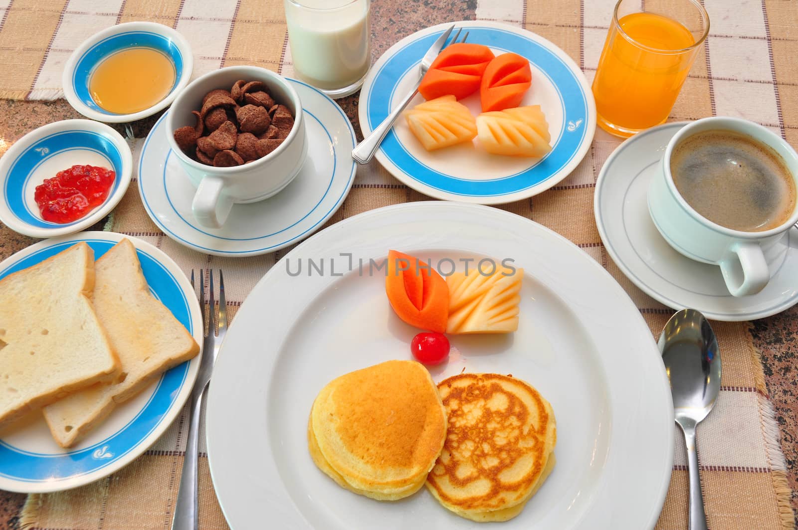 set of american breakfast on table. by nopparats
