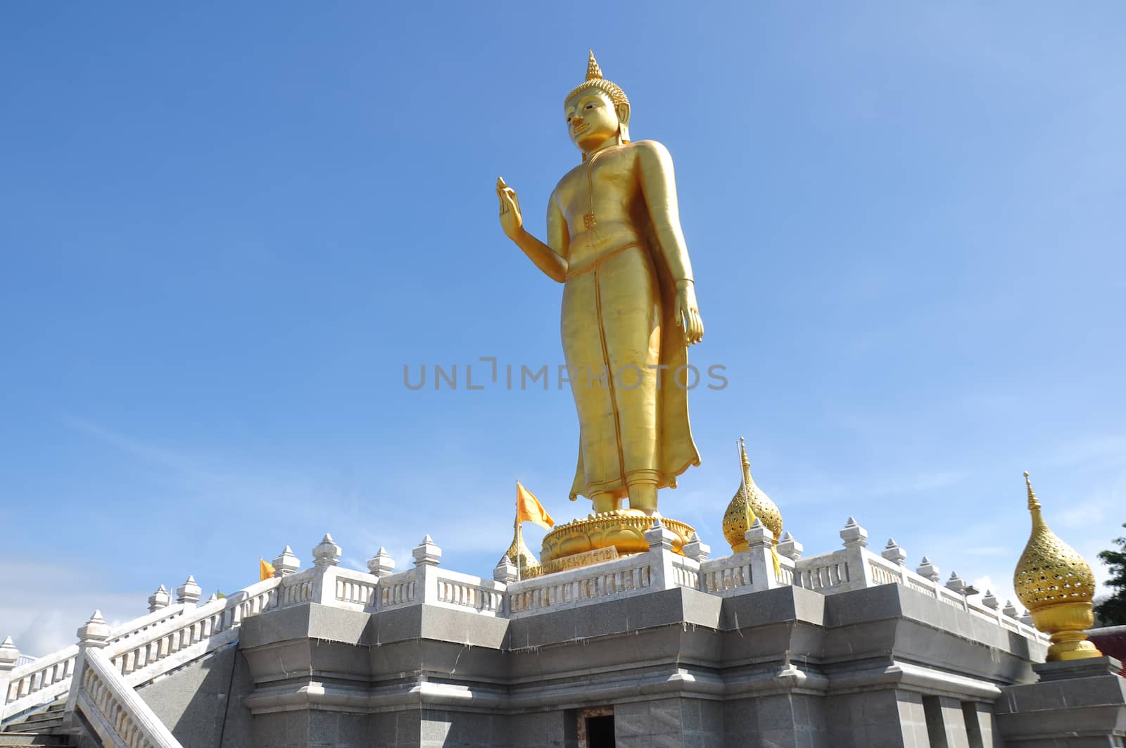 Buddha standing on a mountain , Thailand