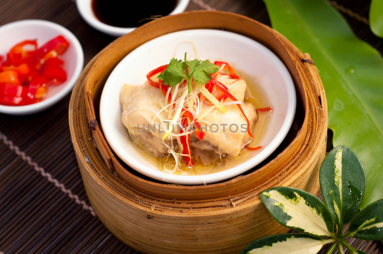 Dim sum in bamboo steamer by nopparats