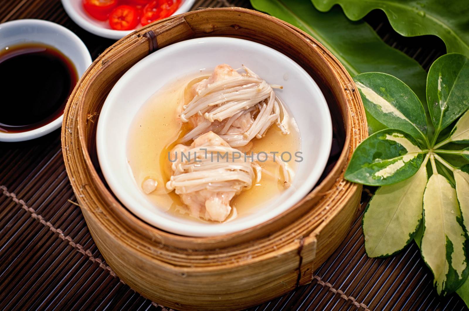 Dim sum in bamboo steamer by nopparats