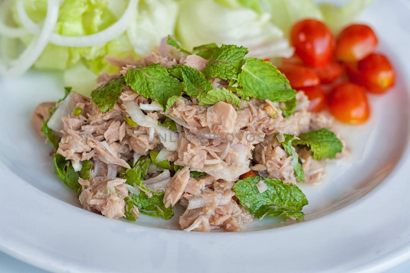 fresh chopped tuna salad with spinach by nopparats