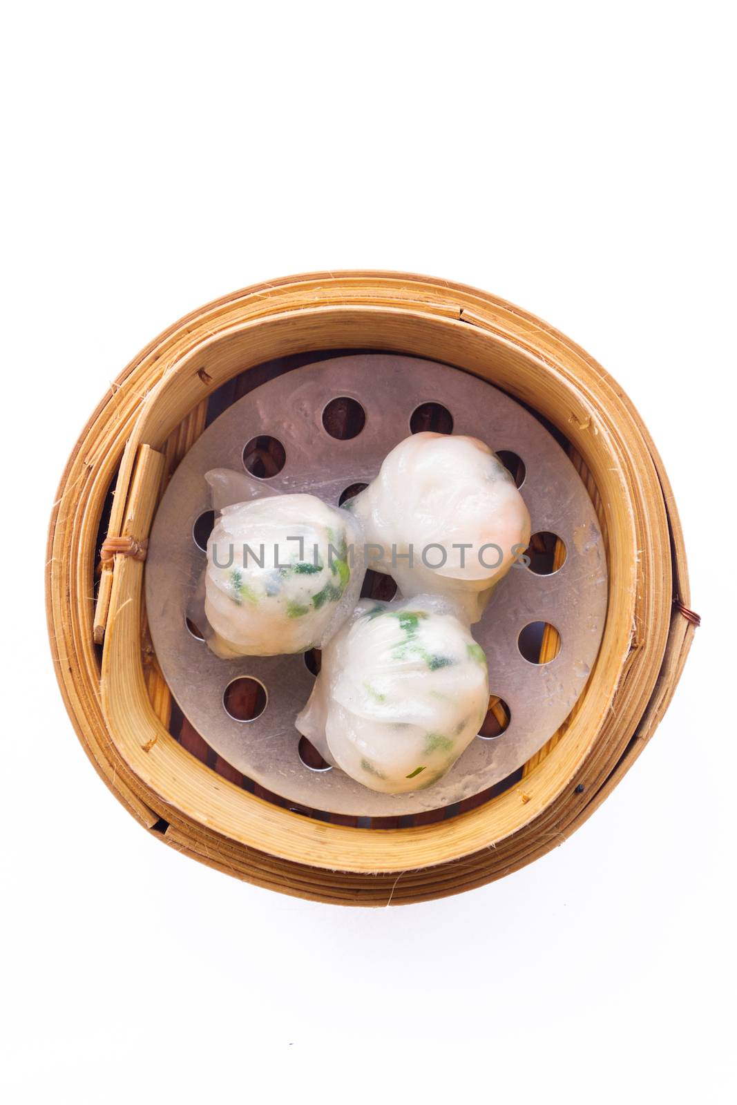 Dimsum in the steam basket . Chinese dimsum steamer prawn isolated on white background.