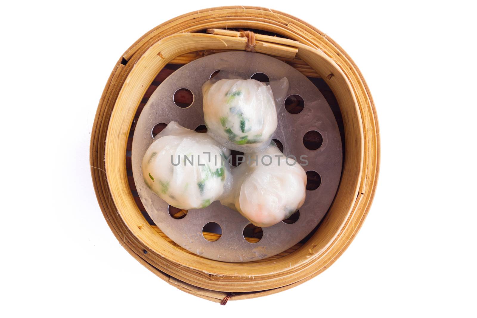 Dimsum in the steam basket . Chinese dimsum steamer prawn isolated on white background.