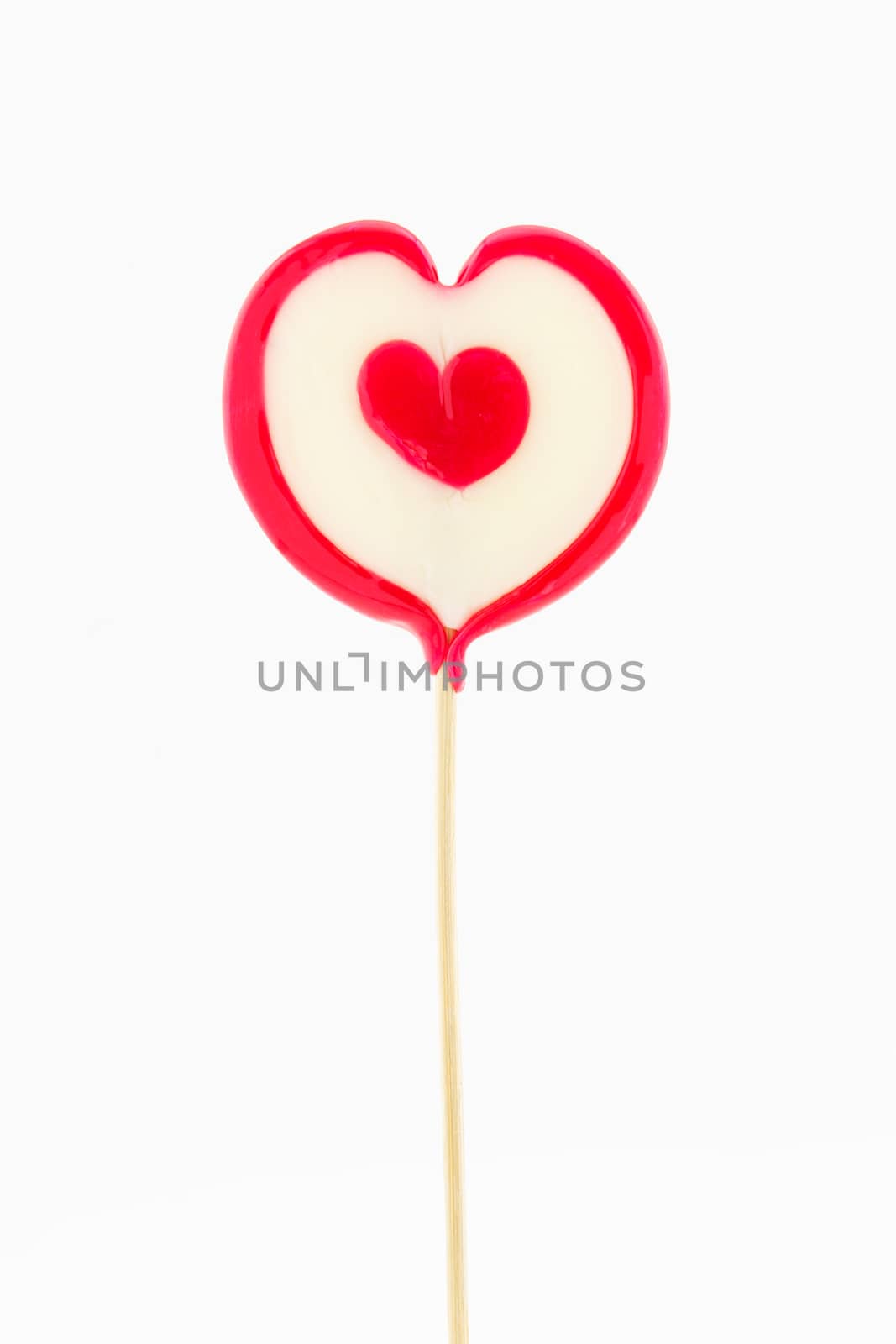 heart shaped lollipop isolated on white background