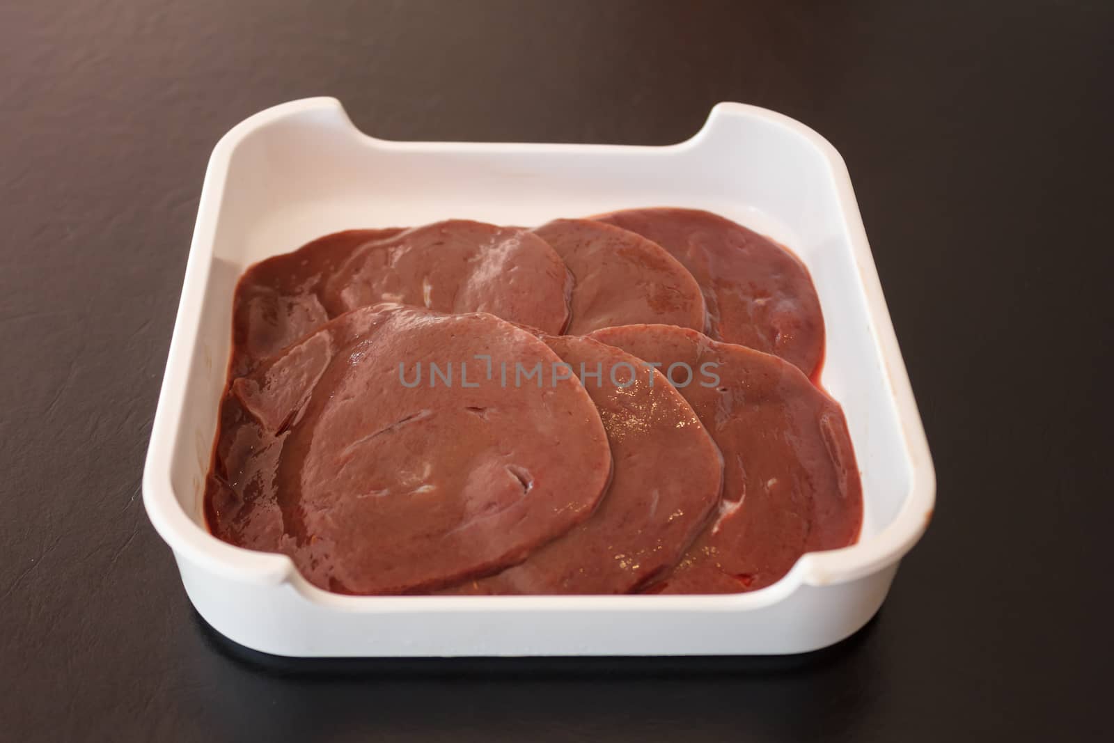 Fresh and raw liver in tray
