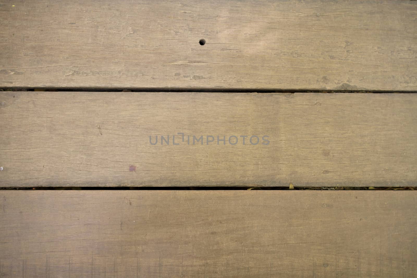Wooden texture background tiles seamlessly in all directions.