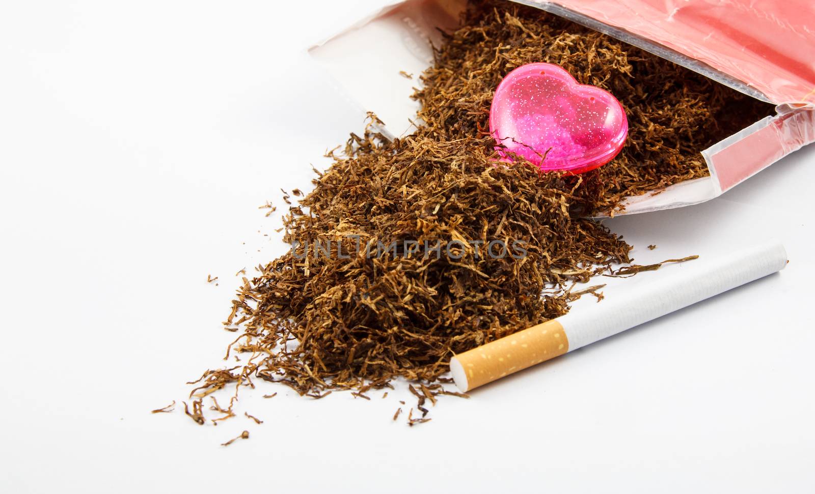 Pink Heart on Tobacco on white background (Concept)