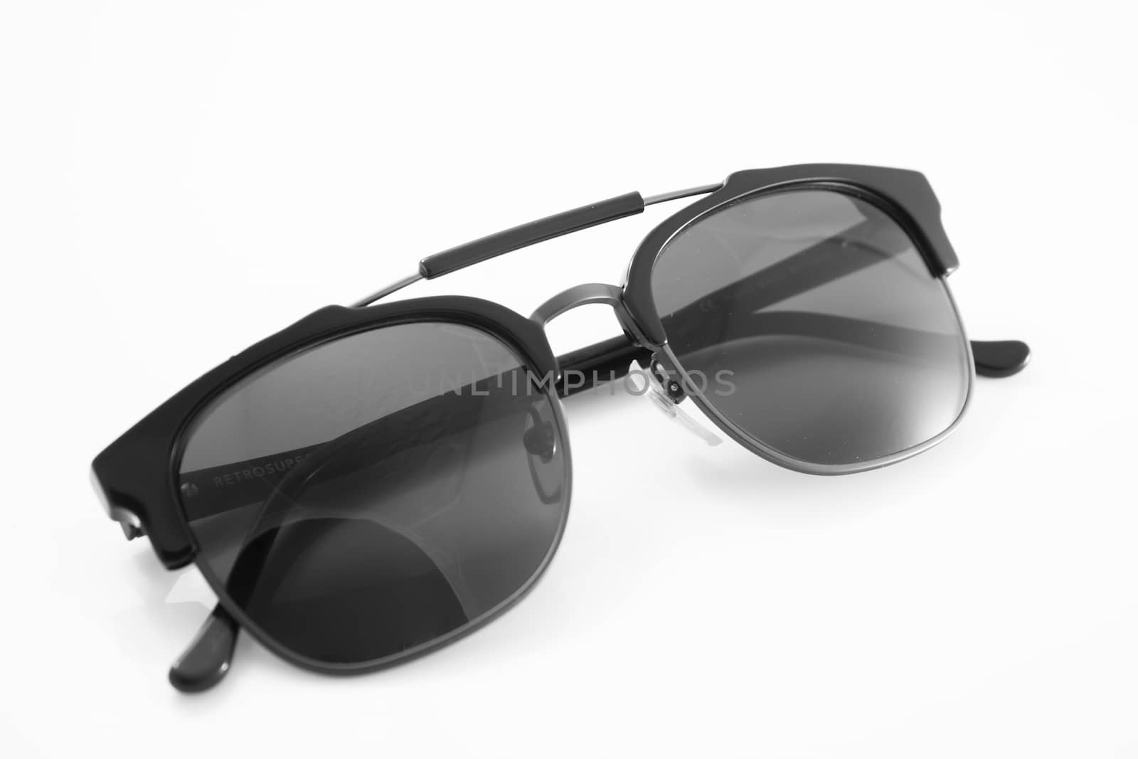 Unisex black modern sunglasses isolated on white background, stock photo