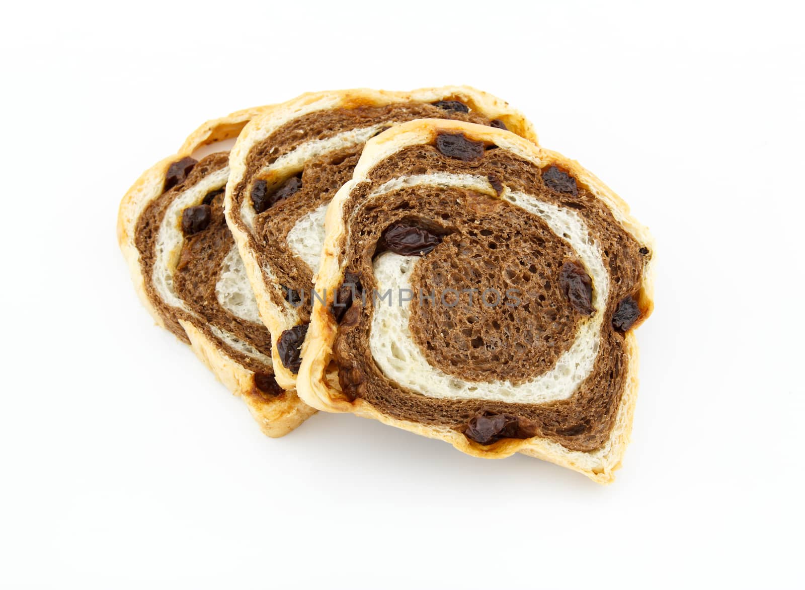 Sliced raisin chocolate bread on white background