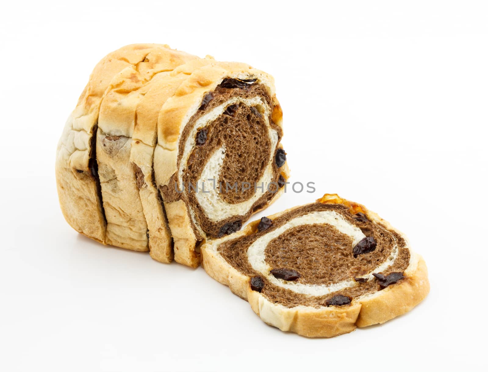 Loaf of sliced raisin bread on white background