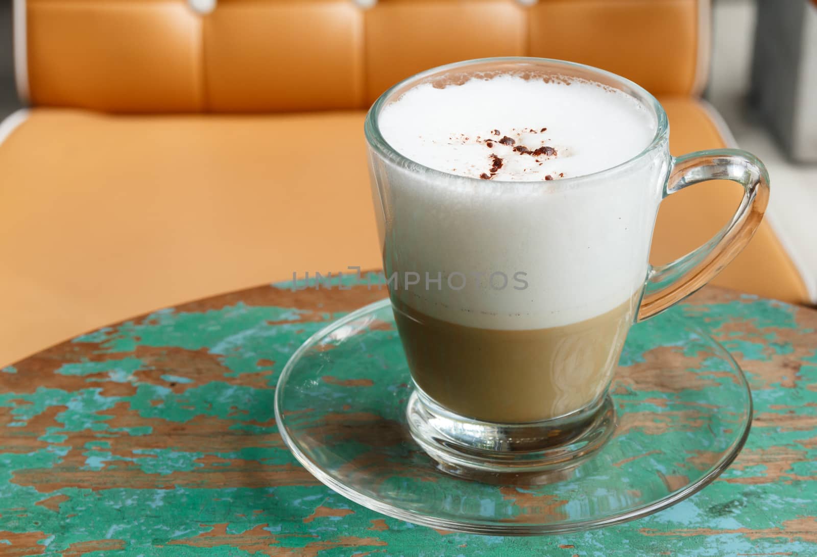 Hot Cappuccino Coffee on Wooden Table at cafe