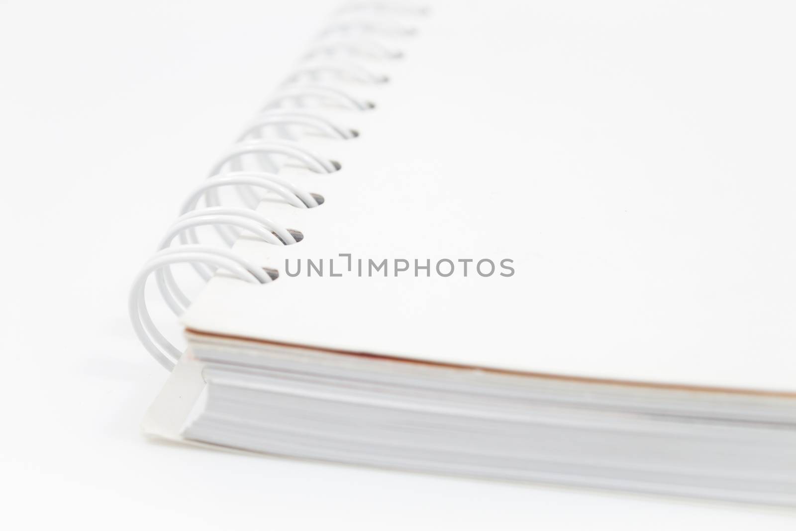 Closeup spiral notebook isolated on white background by punsayaporn