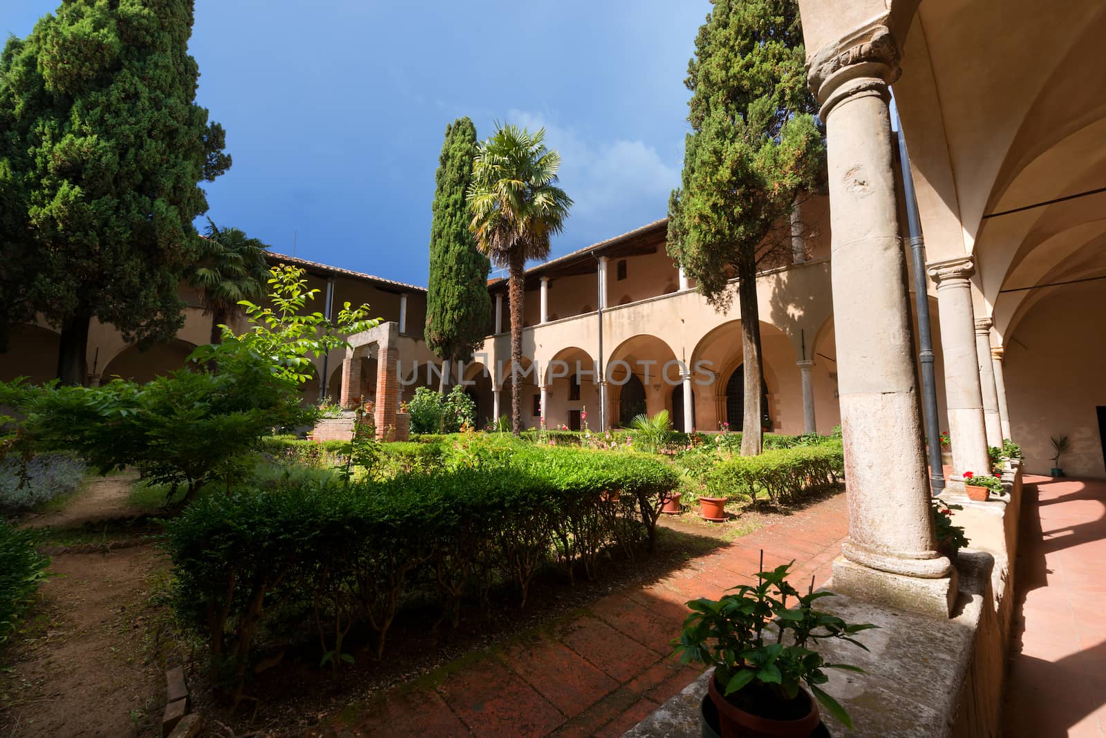 Ancient cloister (XV century) next to the church of Sant'Agostino (1298) - San Gimignano, Siena, Tuscany, Italy