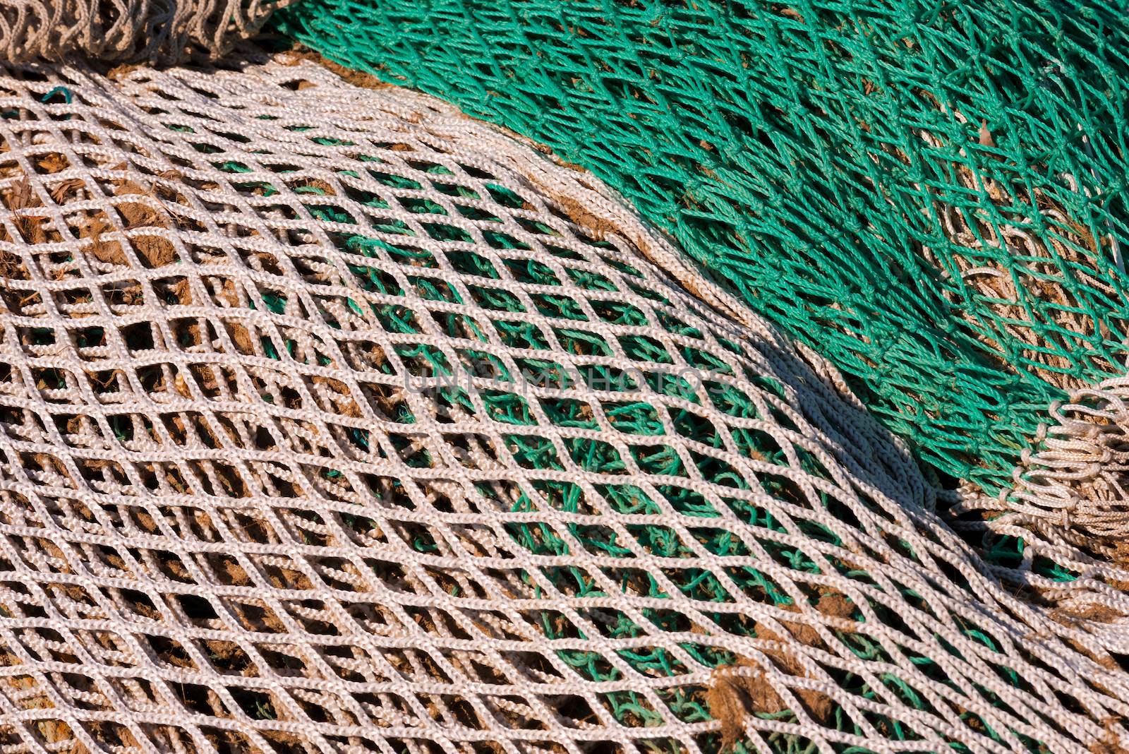 Close up of green, white and brown fishing net