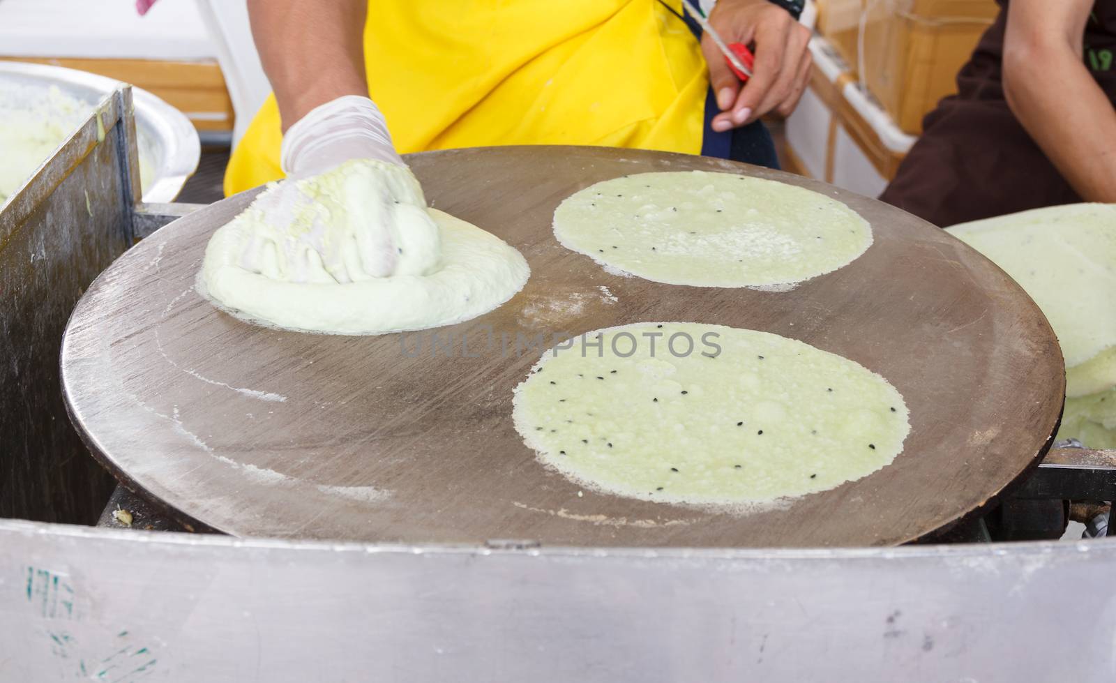 sheet flour on hot pan for wrap cotton candy (Thai dessert name Roti saimai)