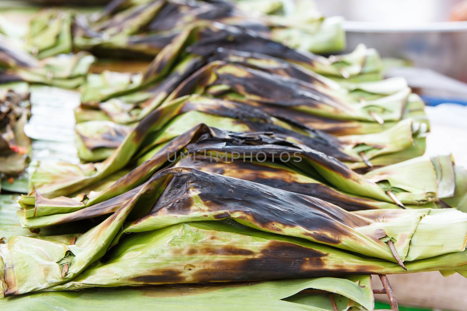 steamed fish with curry paste in banana leaves wrap (thai food)