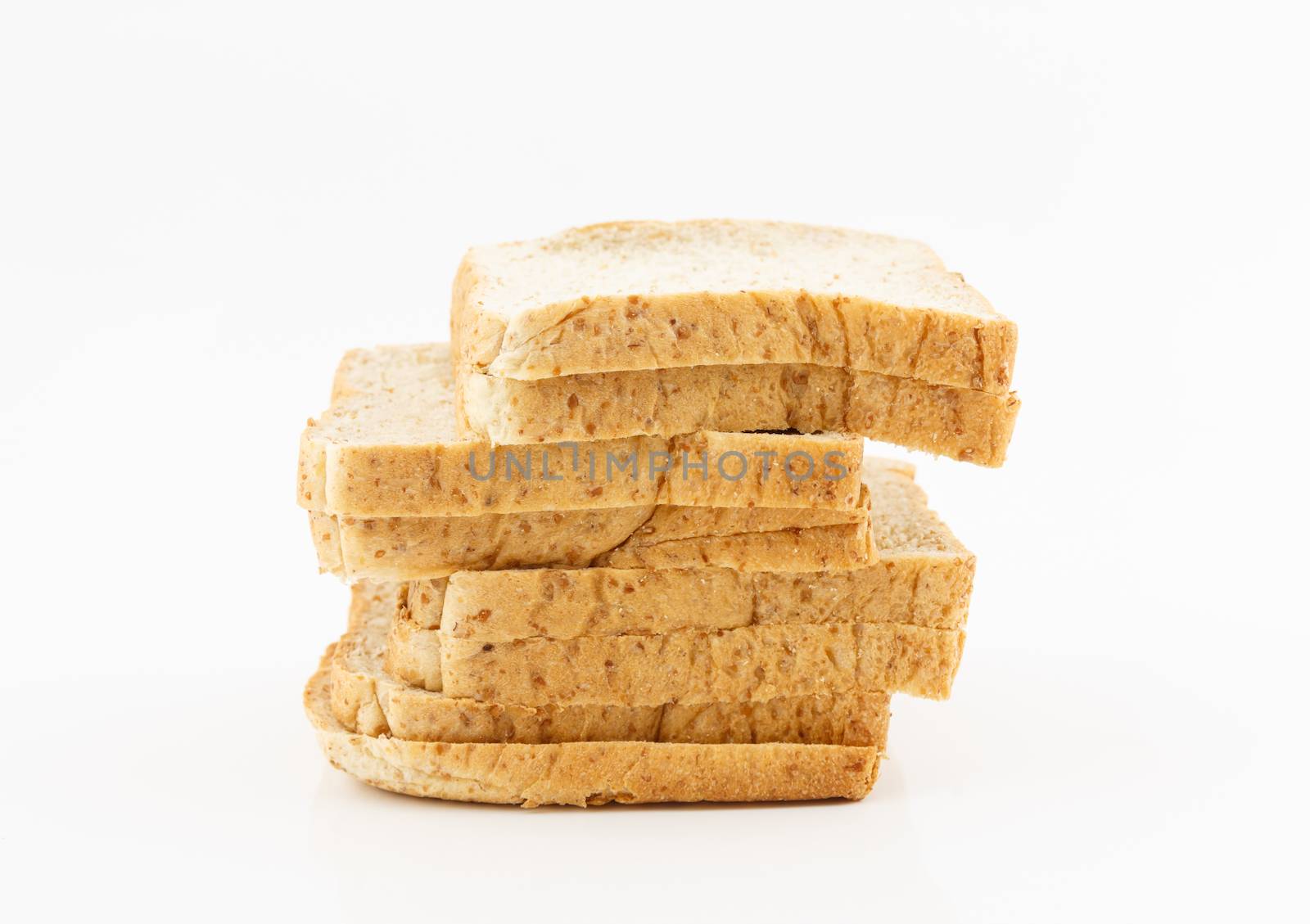 Sliced whole wheat bread on white background