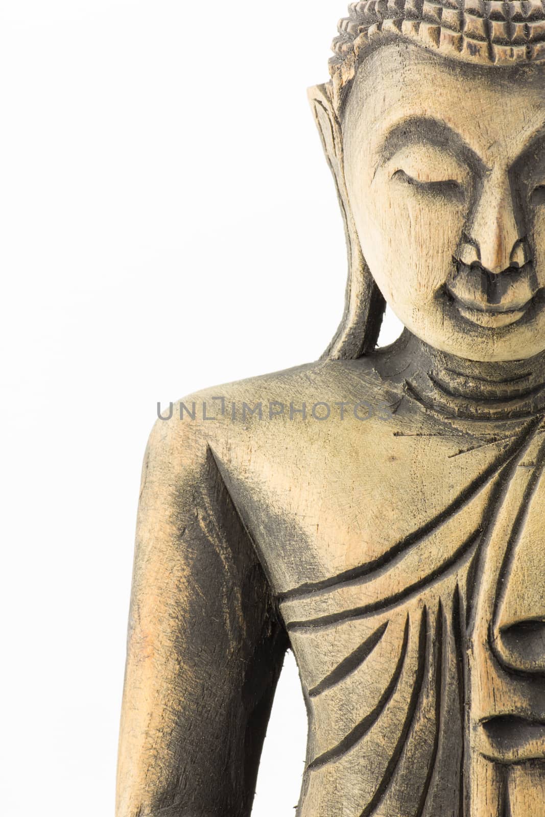  face of Buddha wood carving isolated on white background by vitawin