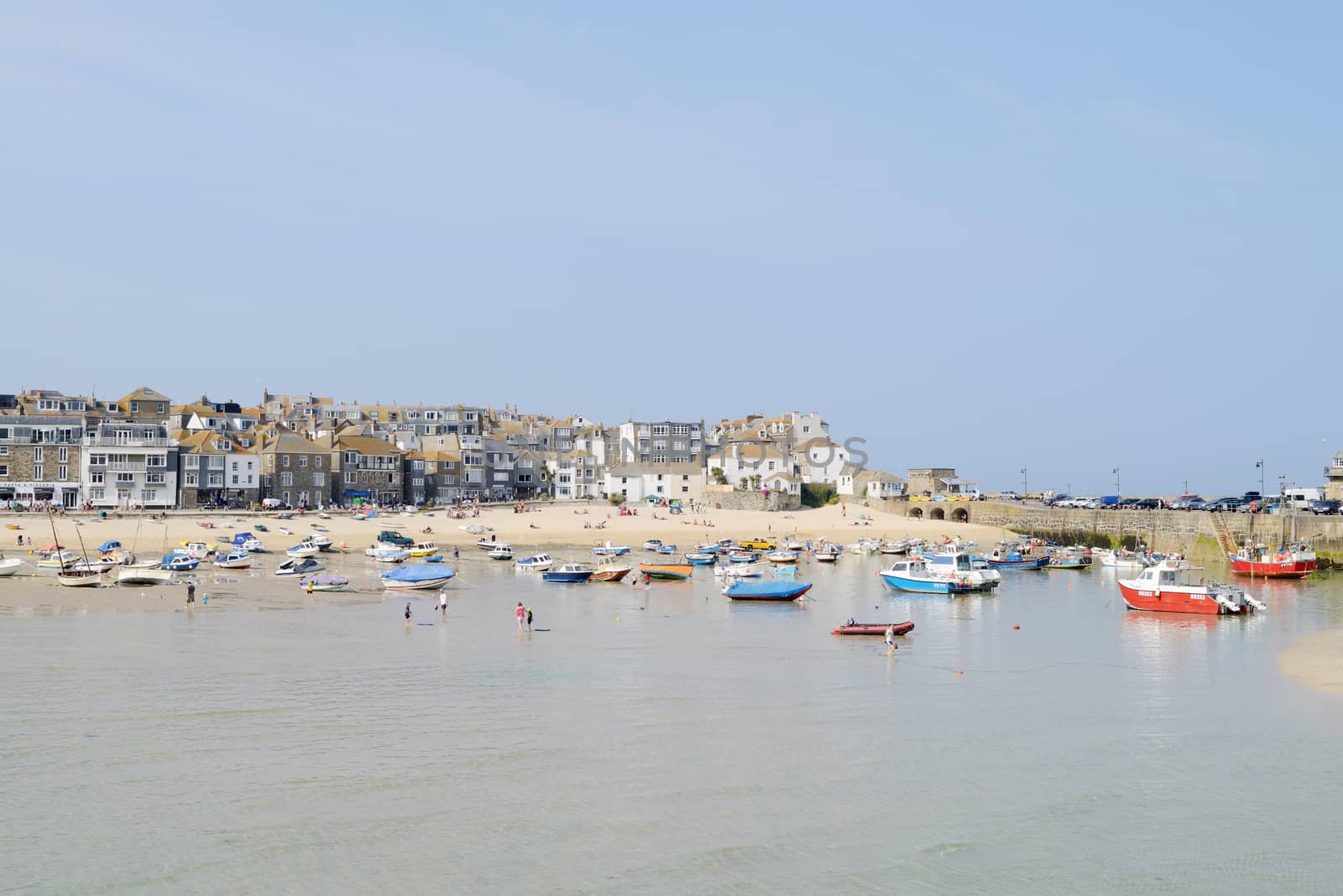 St Ives in Cornwall on a sunny day showing fishing boats in the harbour