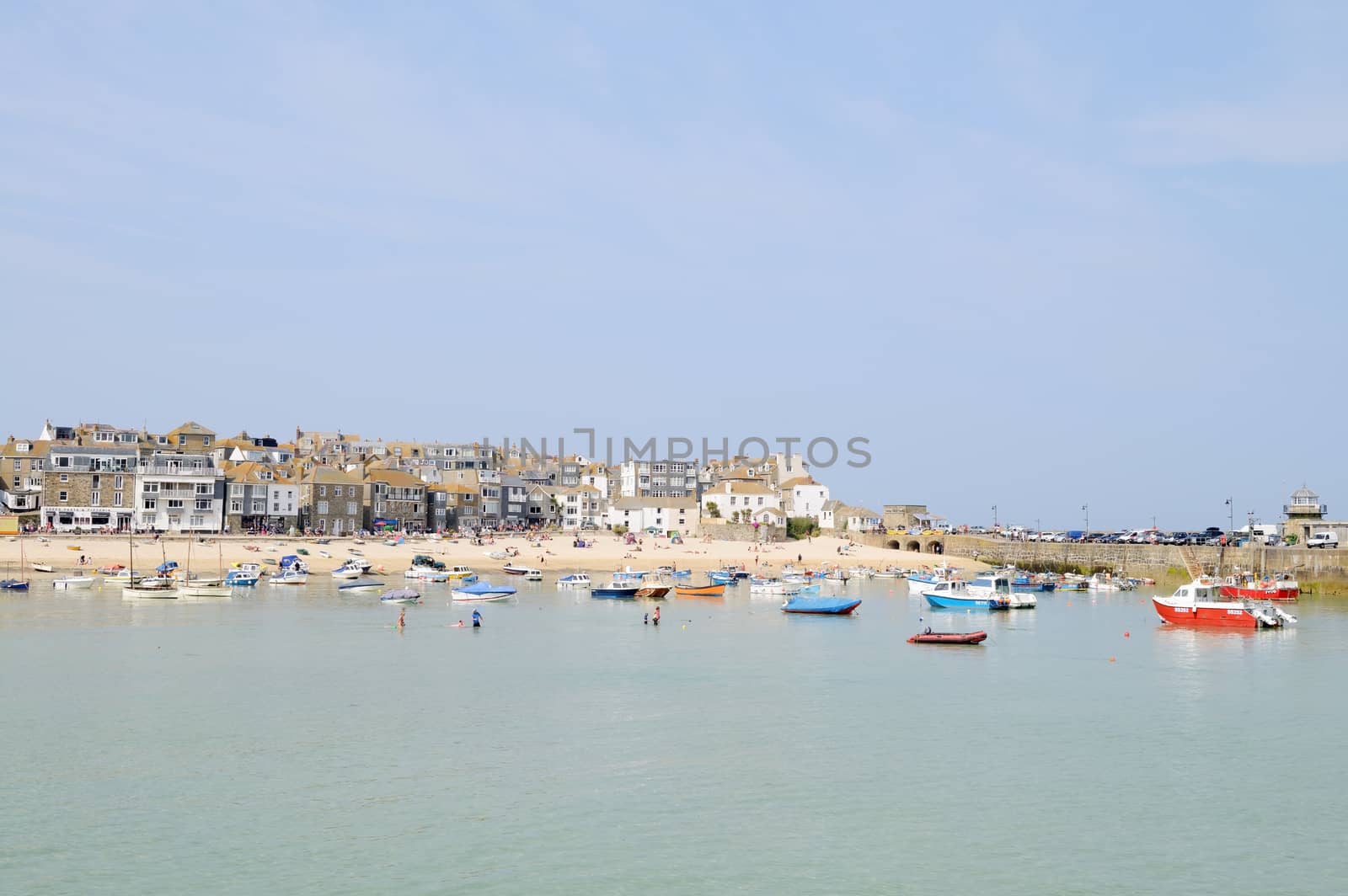 St Ives in Cornwall, England. On a sunny day in the summer showing boats in sea.