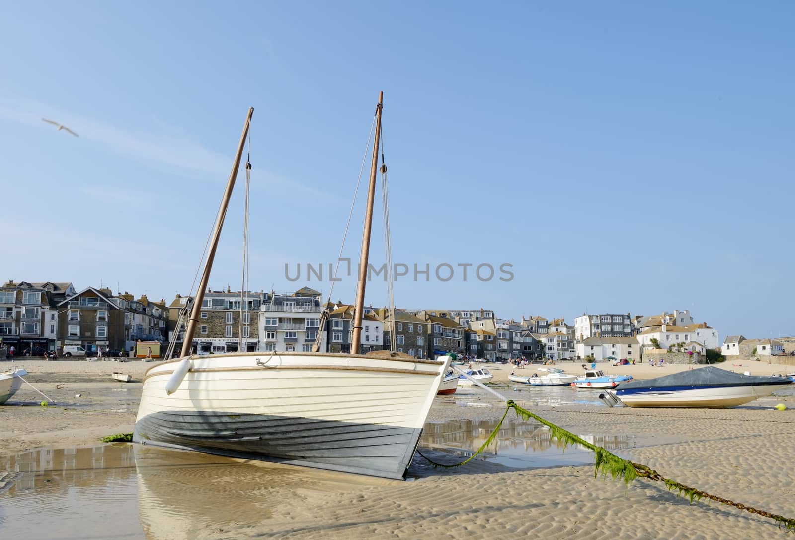 Closeup of traditional fishing boat on the sandy beach in St Ives Cornwall on a sunny summer day