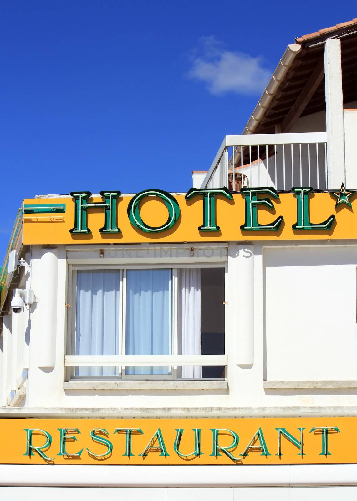 Colorful hotel and restaurant building by beautiful day