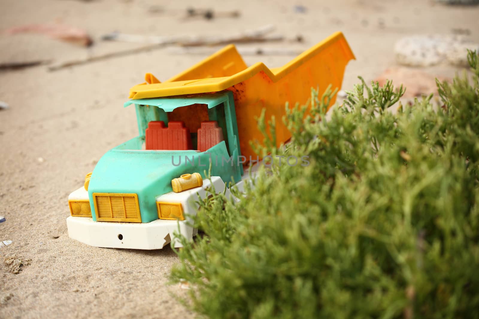 broken toy truck thrown from the sea