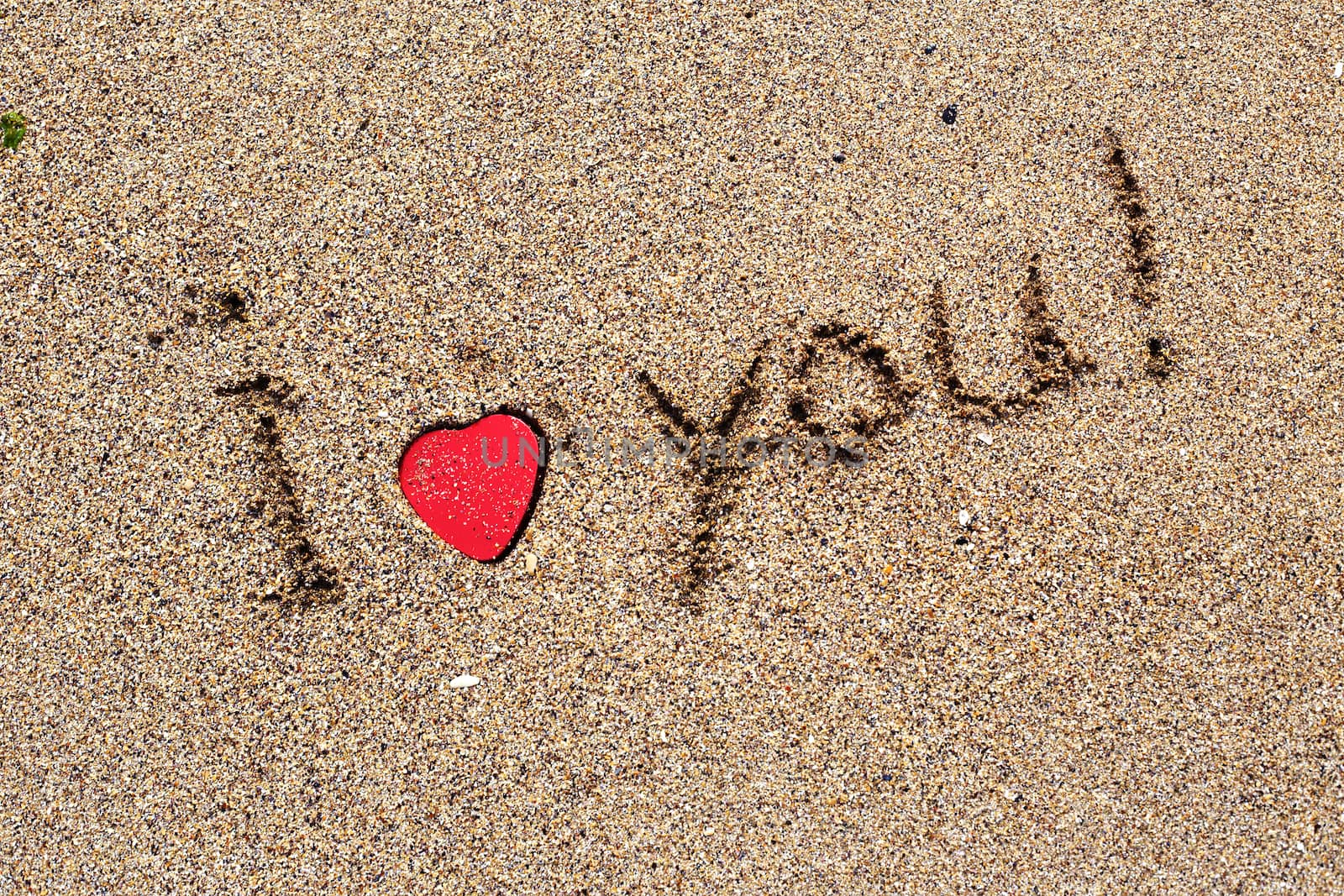 I love you note on the beach