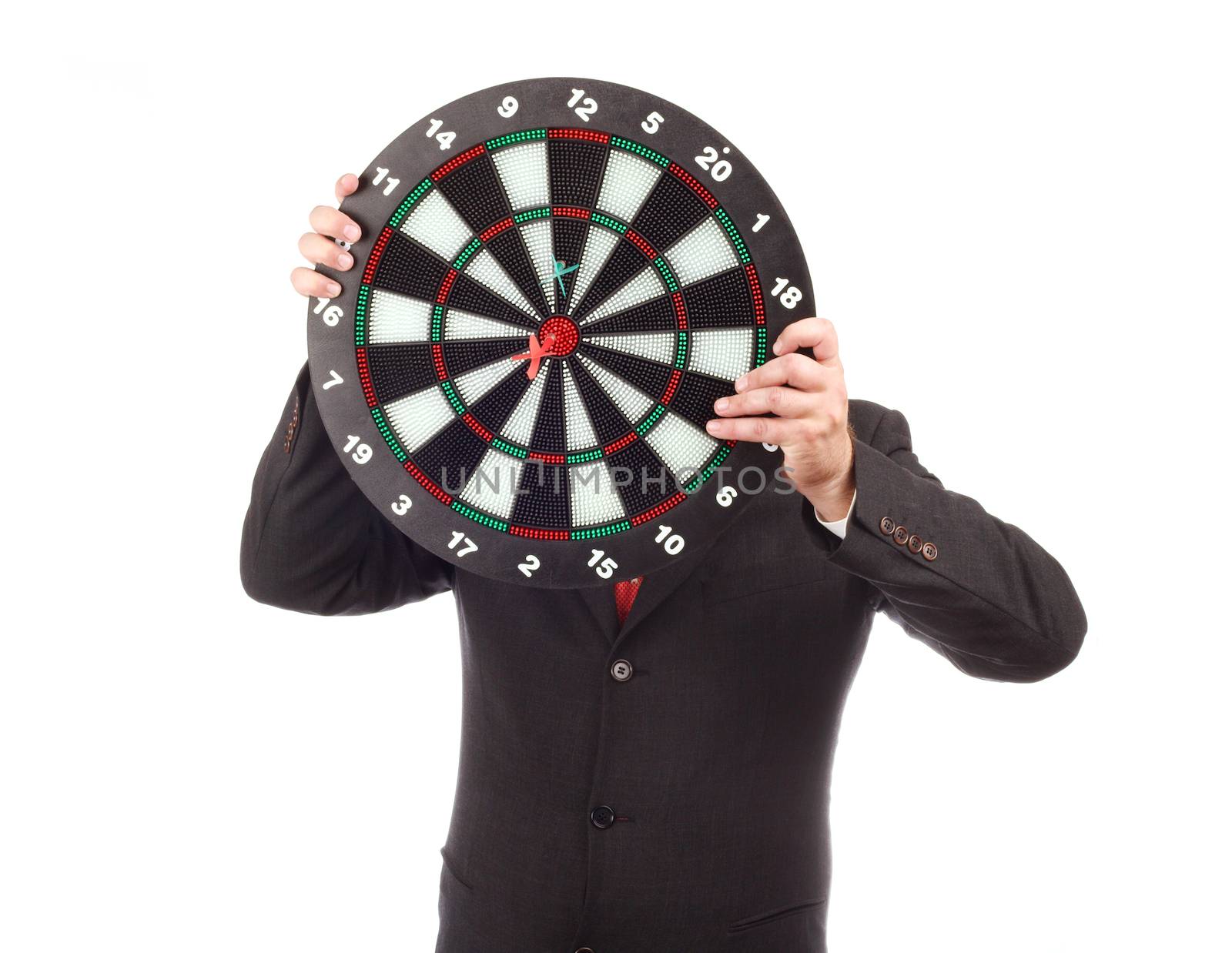 businessman hiding behind a darts board