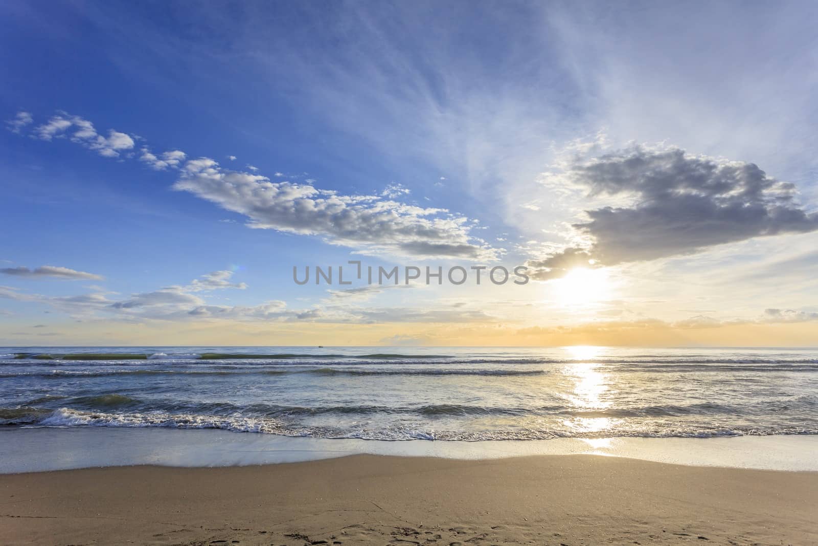 Seascape with suggestive sky at early sunset