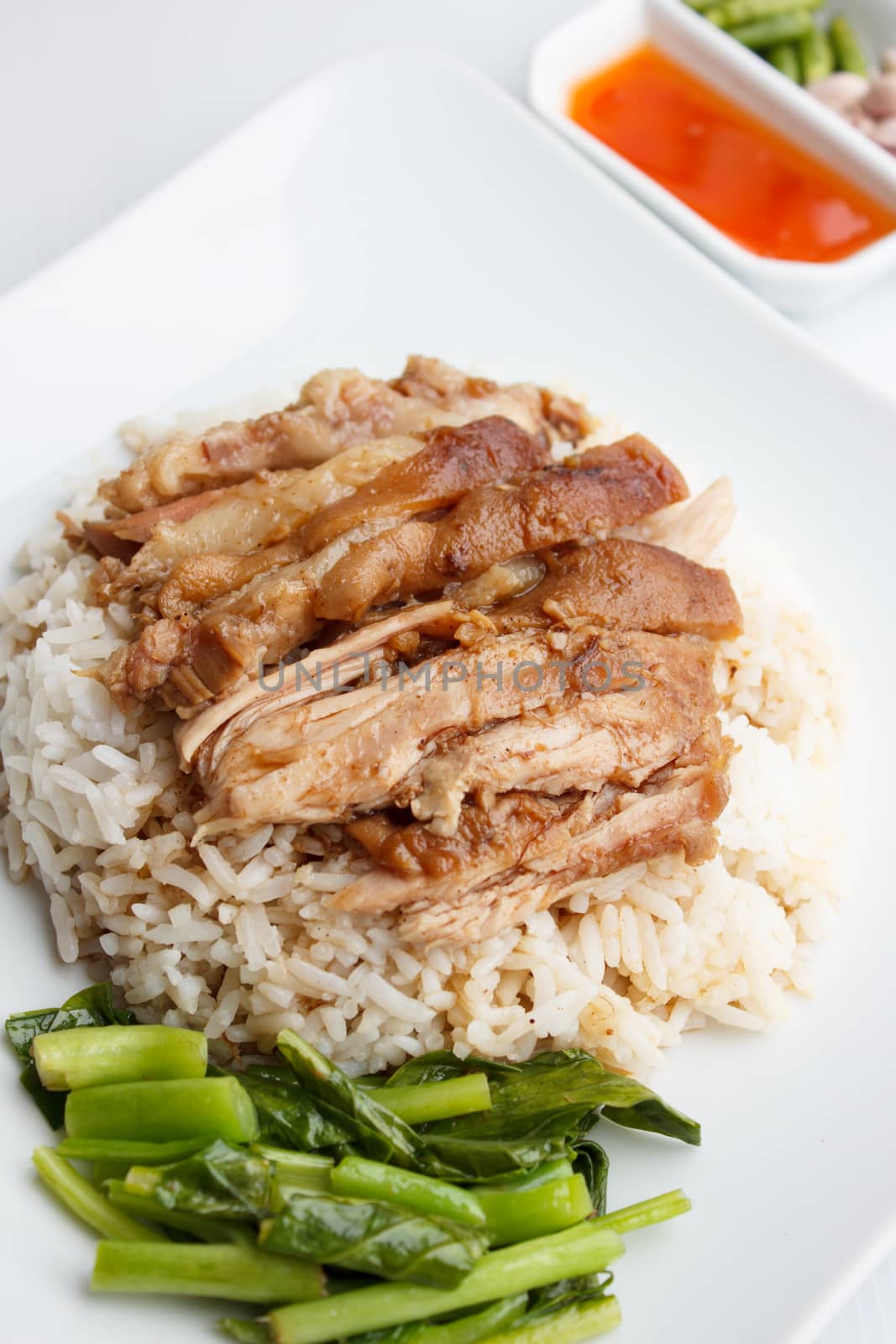 Pork leg with rice and  sauce isolated on white background