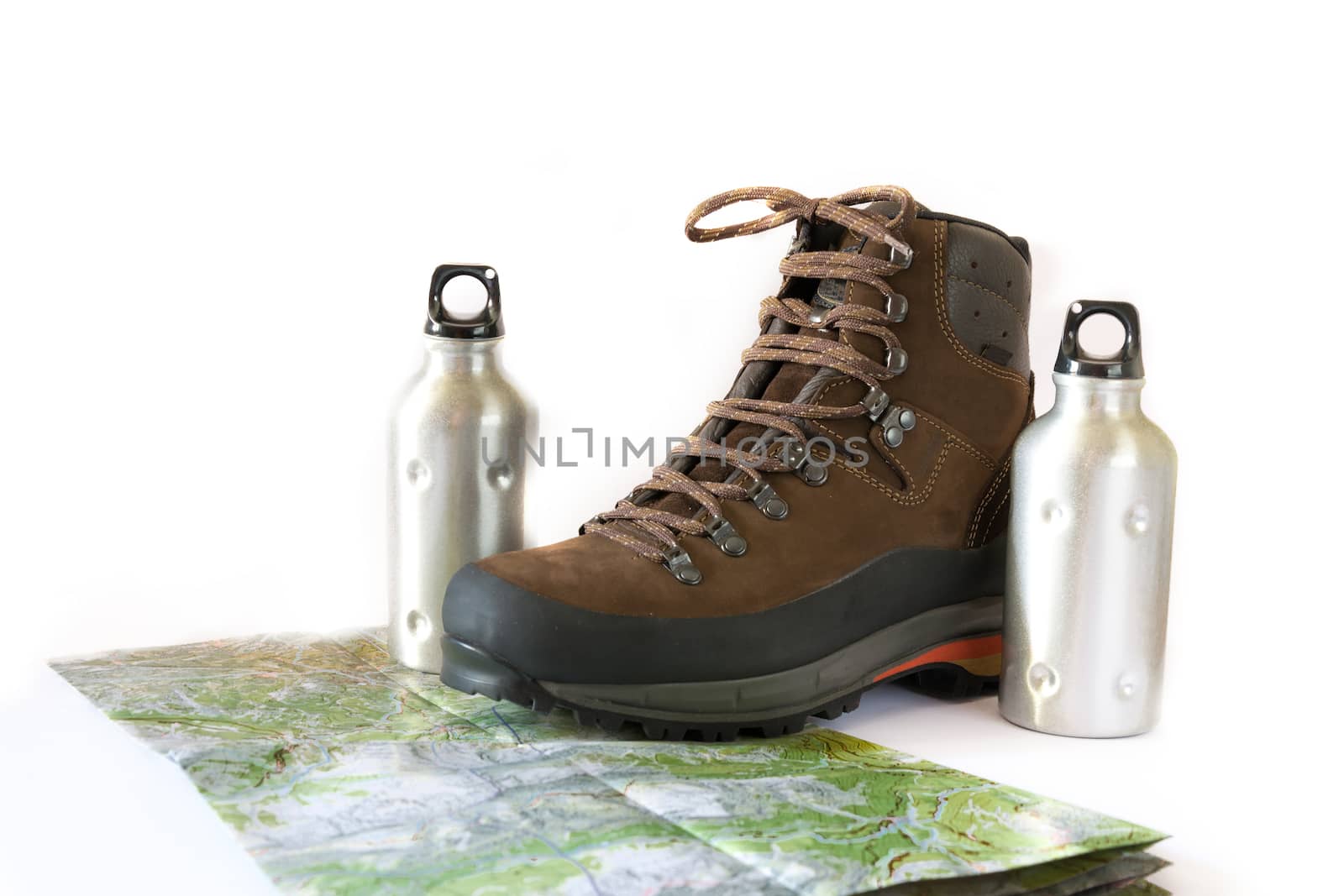 hiking boot with two water bottles and a topographic map