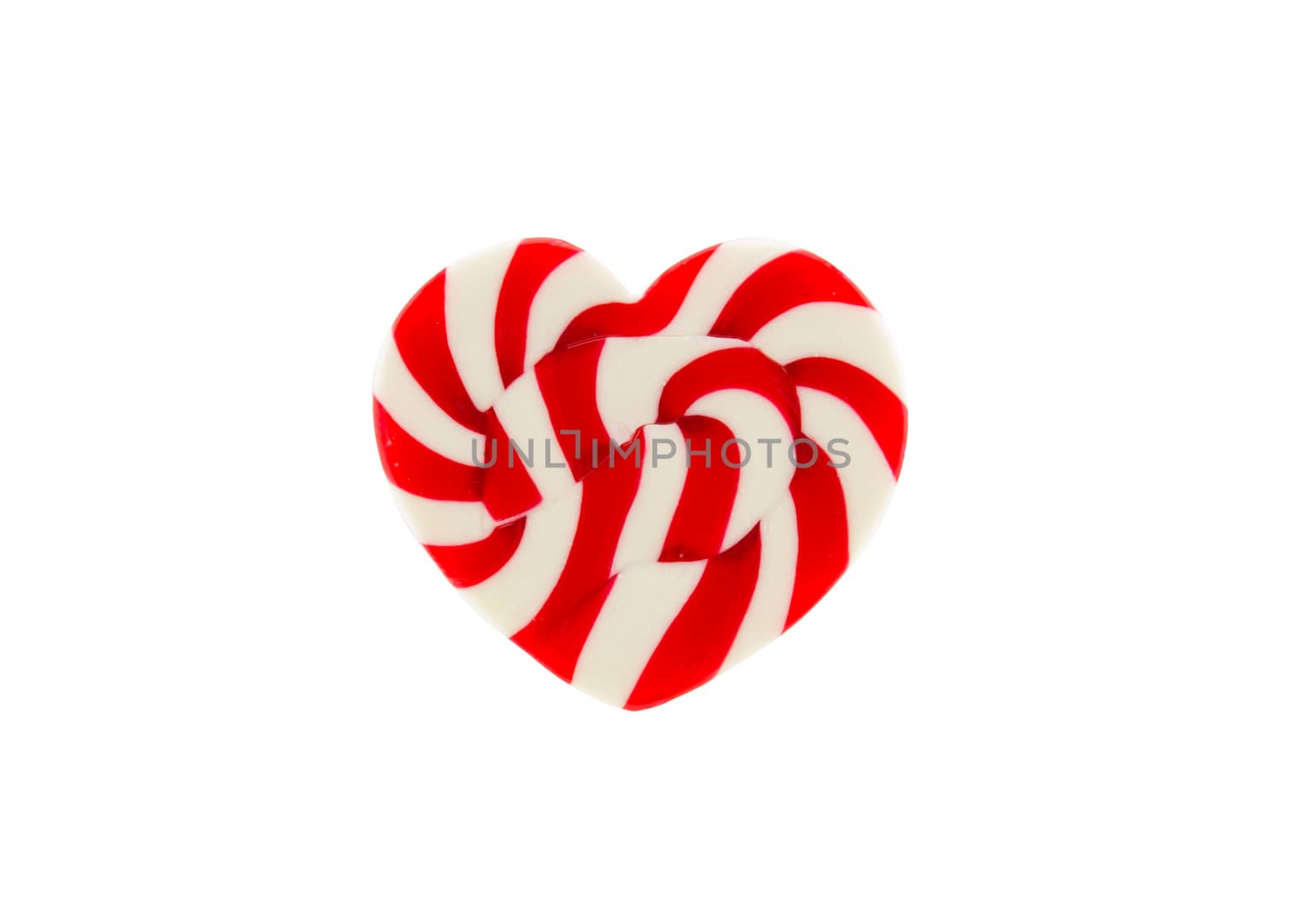 Red candy heart on white background by vitawin