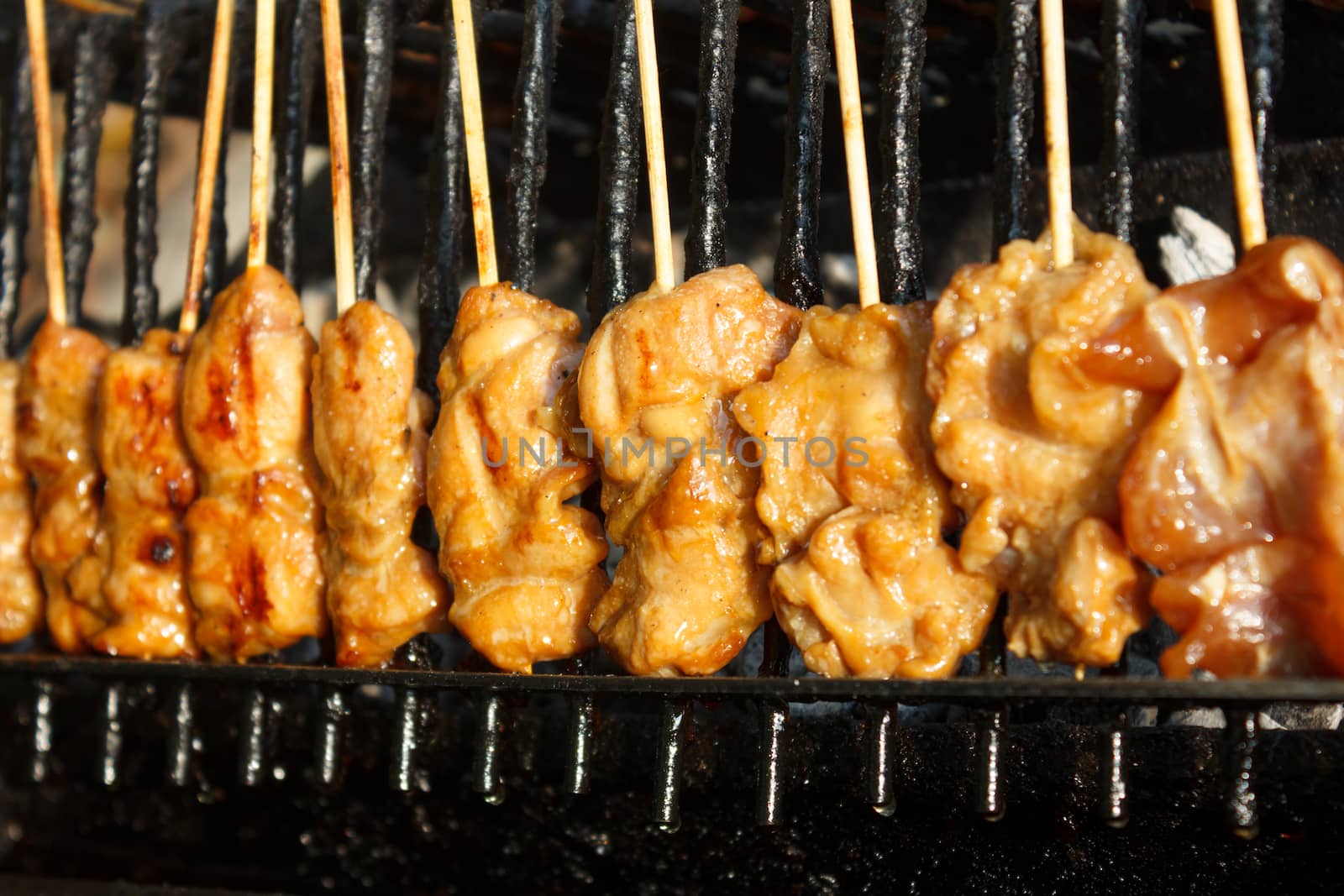 Grilled chicken sticks  on stove (Thai style)