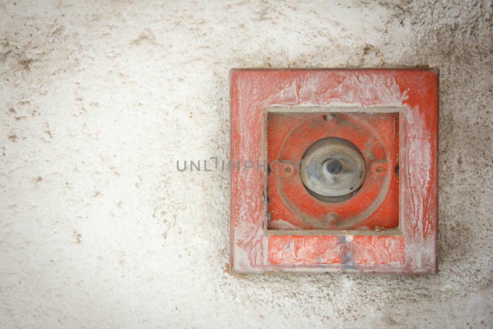 old button fire alarm on white wall by vitawin