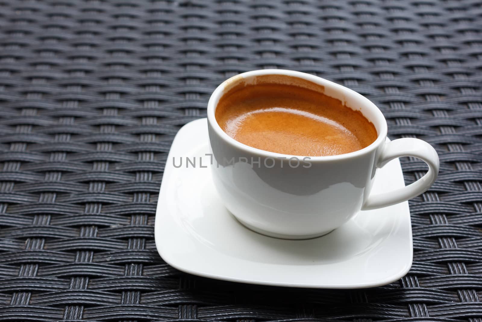 cup of coffee on black table