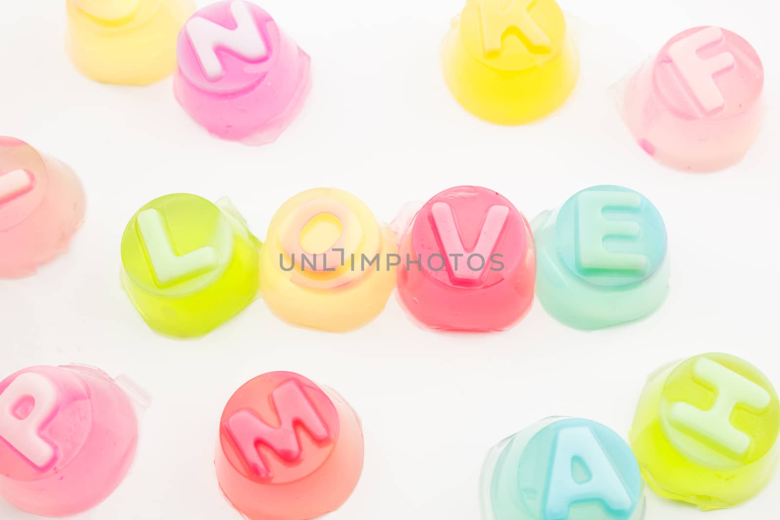 word "love" in jelly isolated on white background by vitawin