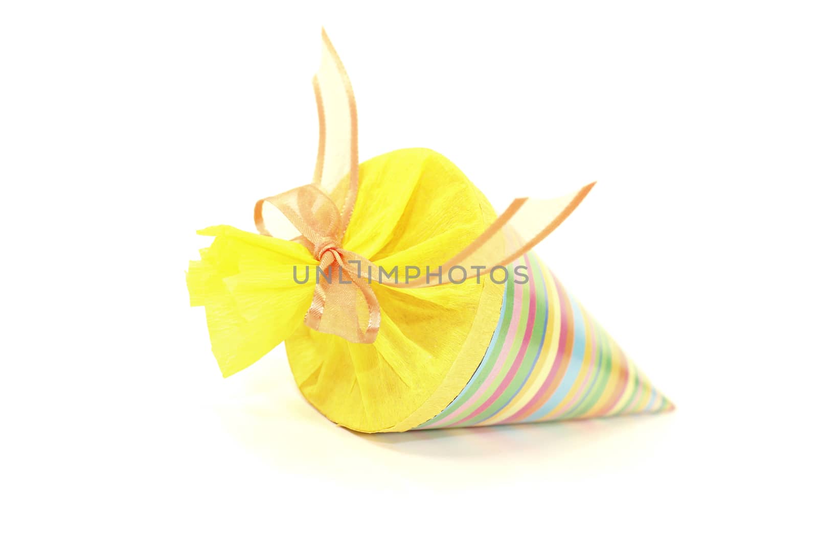 colorful school cone with ribbon on a bright background