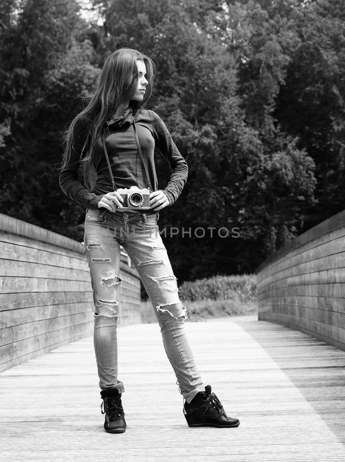 Young woman photographer outdoors by sumners