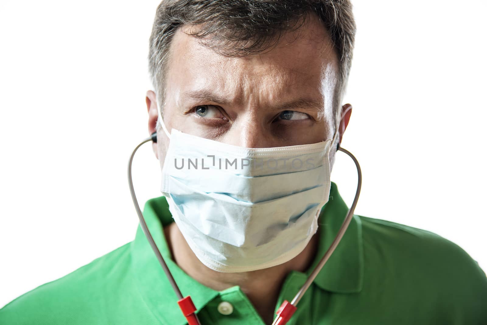 Desperate doctor in green shirt with surgical mask