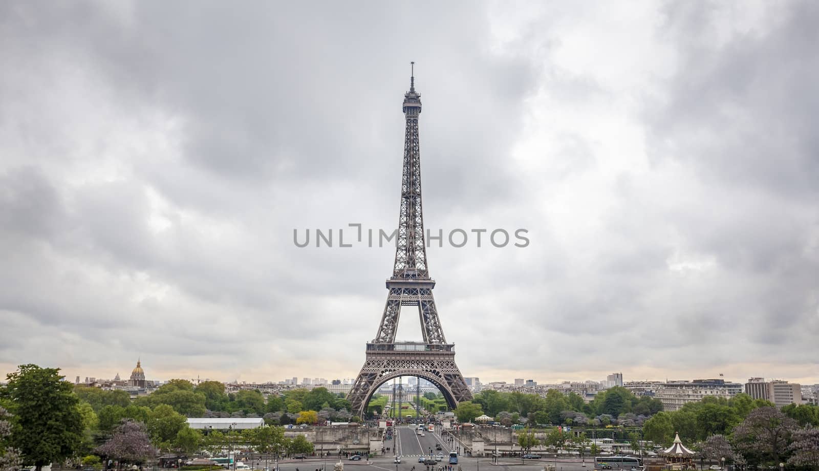 View of the famous Eiffel Tower in Paris, France. Vivid colors in cloudy day