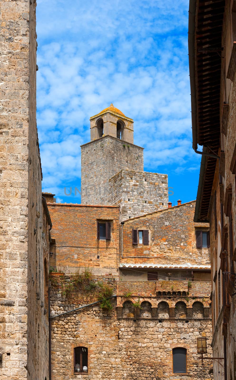 Towers and old buildings in San Gimignano medieval town (UNESCO heritage), Siena, Tuscany, Italy
