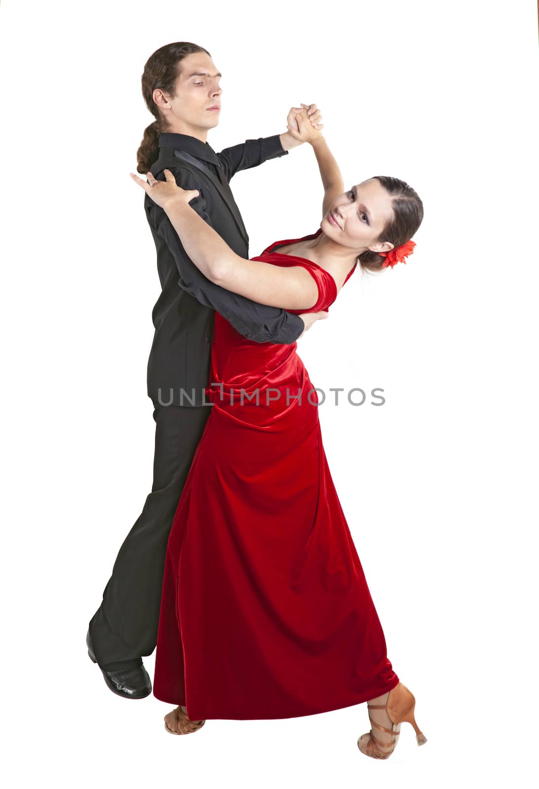 Young couple dancing waltz isolated over white background