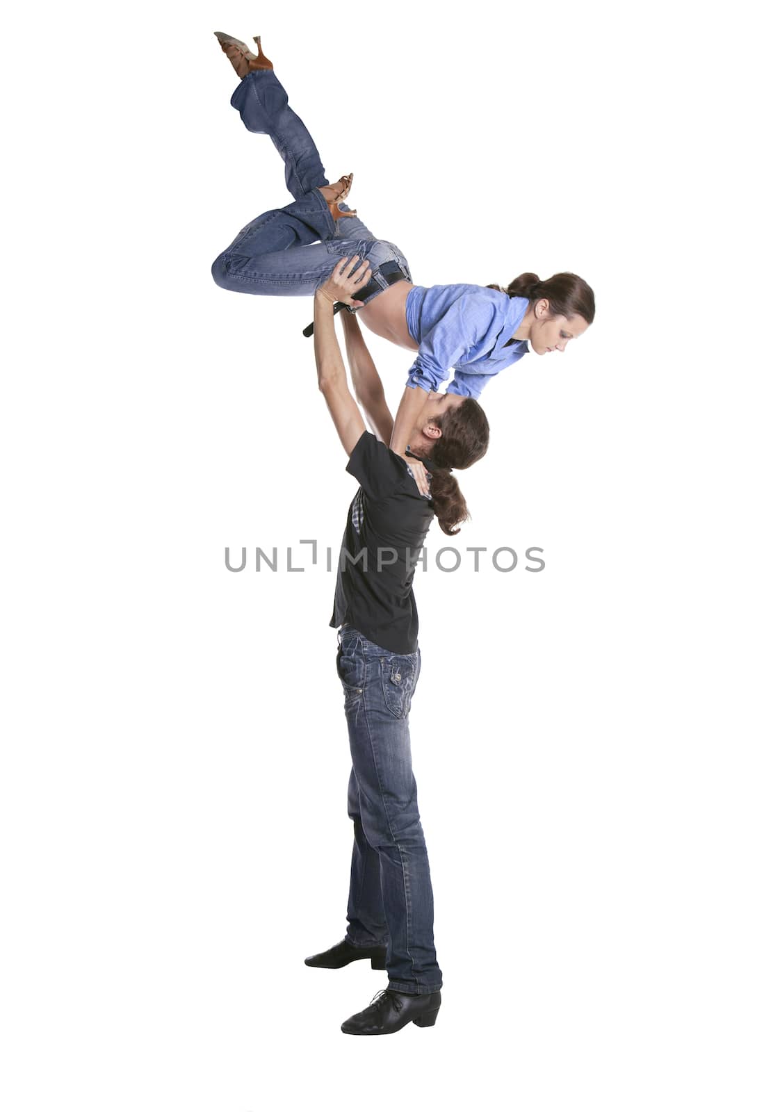Couple making acrobatic feat isolated over white background