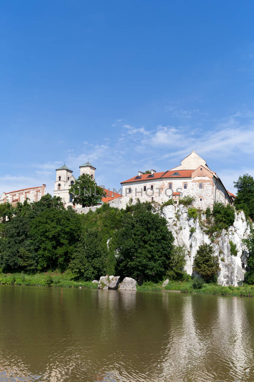 The Benedictine Abbey in Tyniec with wisla river on blue sky background