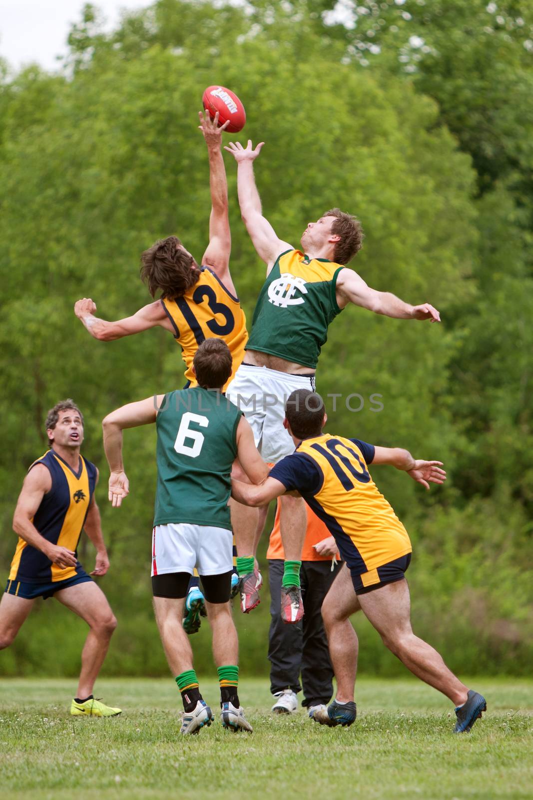 Roswell, GA, USA - May 17, 2014:  Club teams from Baton Rouge and Atlanta compete in an amateur game of Australian Rules Football in a Roswell city park.  