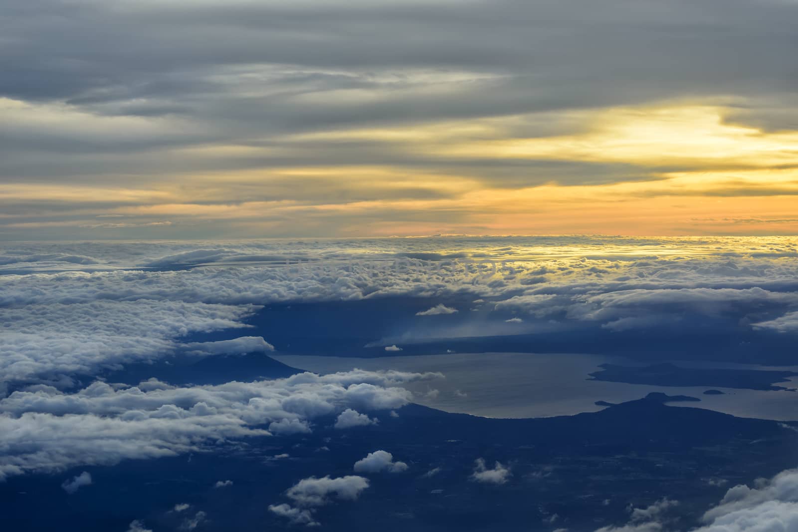 Beautiful sunset cloudscapes shot from window of airplane.